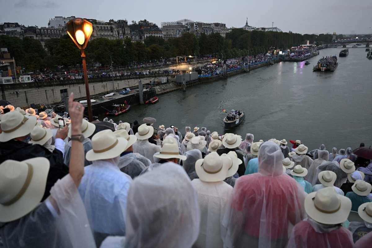 Paris 2024 Olympics - Opening Ceremony - Paris, France - July 26, 2024. Boats carrying members of delegations sail along the Seine during the opening ceremony of the Paris 2024 Olympic Games.