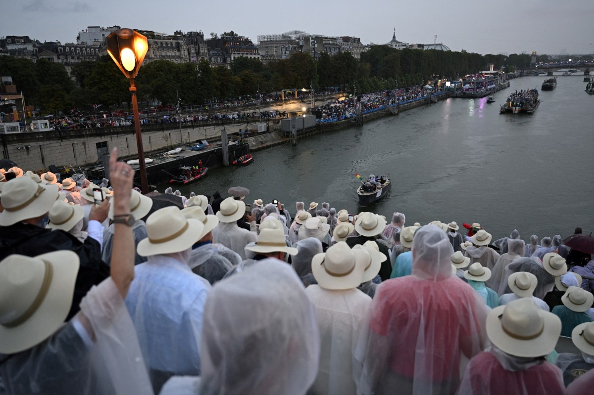Paris 2024 Olympics - Opening Ceremony - Paris, France - July 26, 2024. Boats carrying members of delegations sail along the Seine during the opening ceremony of the Paris 2024 Olympic Games.