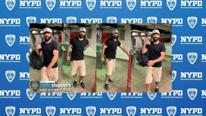 man wearing black shirt, tan shorts and hat in Midtown