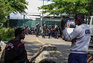Police at the Randall's Island migrant shelter.