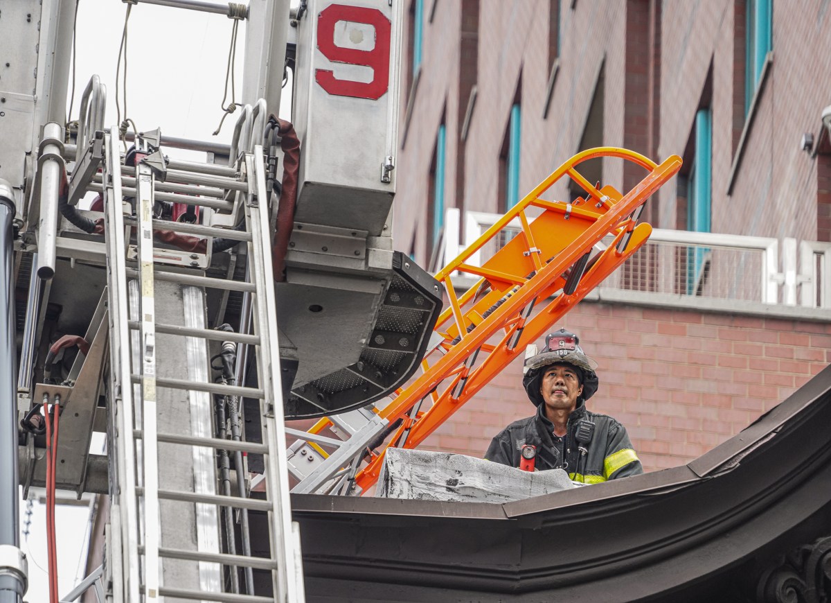 A firefighter on the roof.
