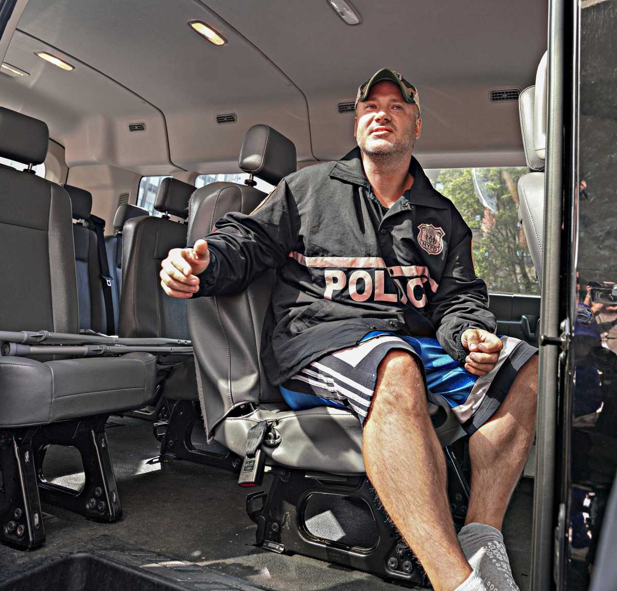 Sgt Carl Johnson of the 5th precinct was wheeled out of Bellevue hospital at around 4:30 p.m. after undergoing surgery for a bullet wound to his thigh just days prior.