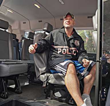 Sgt Carl Johnson of the 5th precinct was wheeled out of Bellevue hospital at around 4:30 p.m. after undergoing surgery for a bullet wound to his thigh just days prior.