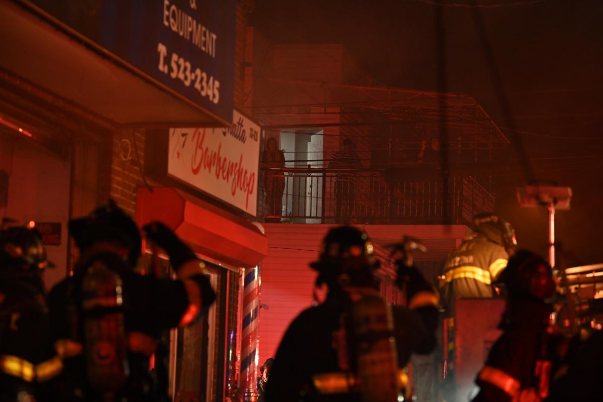 Queens firefighters battle two-alarm fire in auto body shop, remove drums of flammable material 3