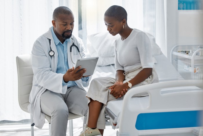 Op-Ed | Primary care needs significant investment to break the cycle of underfunding 4 Doctor consulting patient with digital tablet, giving diagnosis and medical checkup in a hospital. Healthcare worker and trusted physician in appointment with medicine advice, wellness and feedback