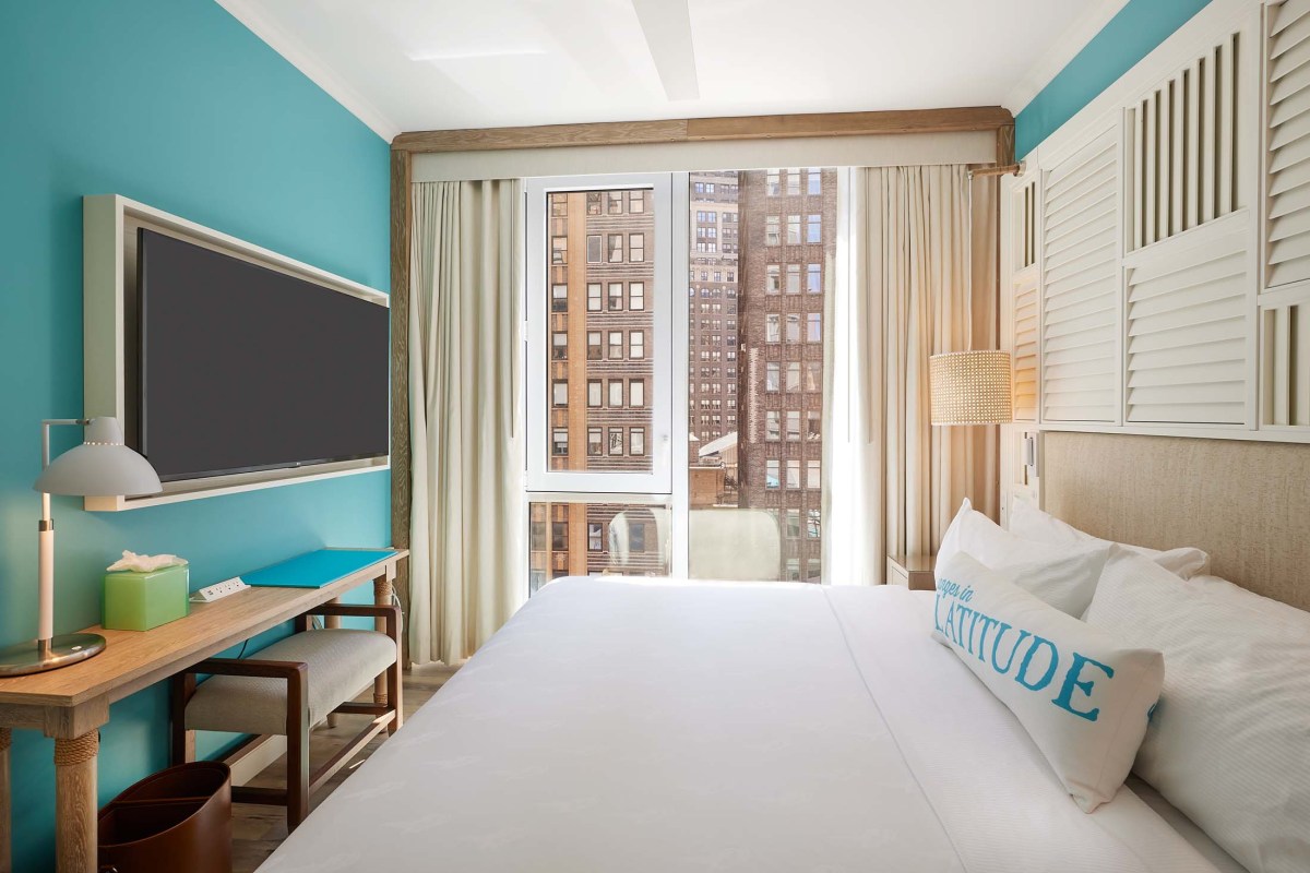 Margaritaville Times Square keeps Jimmy Buffett's legacy alive with good vibes and community building 2 a hotel room with a king bed at Margaritaville Times Square.