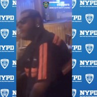 man dressed in black and orange wanted for an alleged assault in the Bronx