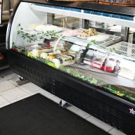 deli counter that has spreads and cheese