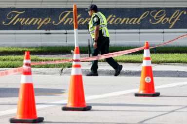 A law enforcement officer walks after reports of shots fired outside Republican presidential nominee and former U.S. President Donald Trump's Trump International Golf Course in West Palm Beach, Florida, U.S. September 15, 2024.