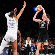 Breanna Stewart shoots over A'ja Wilson Liberty Aces
