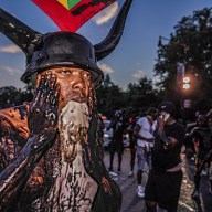 J'ouvert reveler in Brooklyn wearing horns