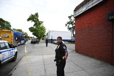 Police outside Brooklyn high school where teen was shot