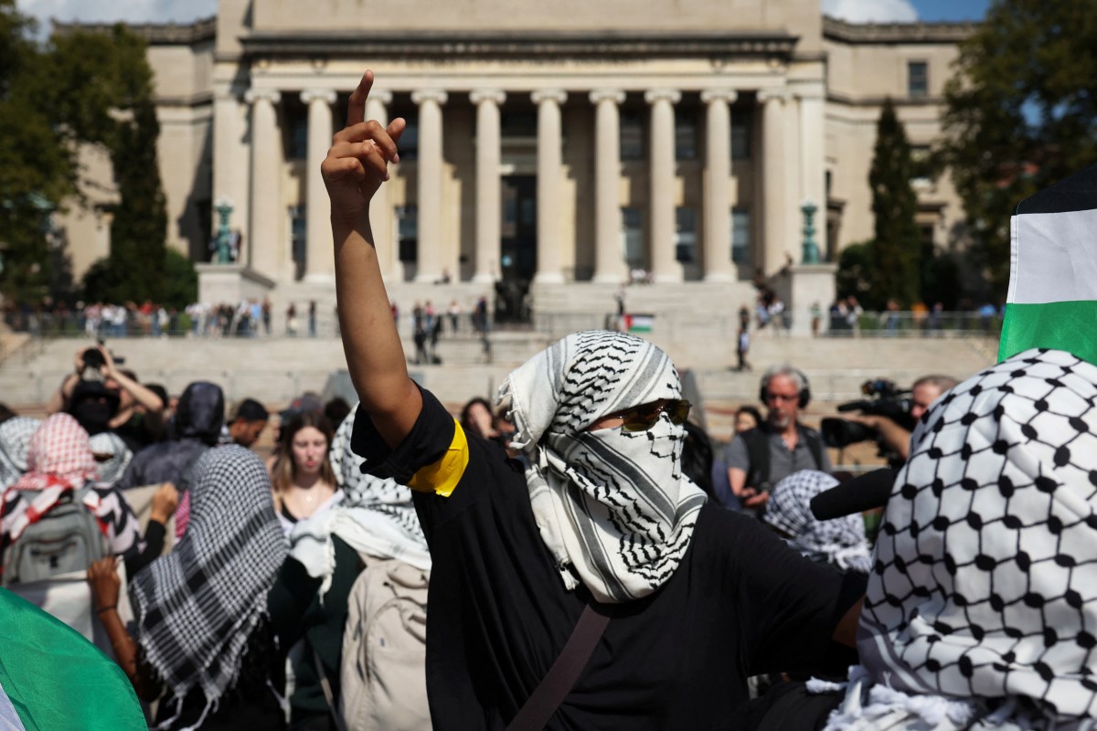 A pro-Palestinian demonstrator gestures on the campus of Columbia University