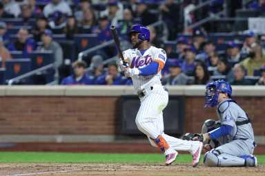 New York City, New York, USA; New York Mets outfielder Starling Marte (6) hits a double in the sixth inning against the Los Angeles Dodgers during game five of the NLCS for the 2024 MLB playoffs at Citi Field. Mandatory Credit: Brad Penner-Imagn Images