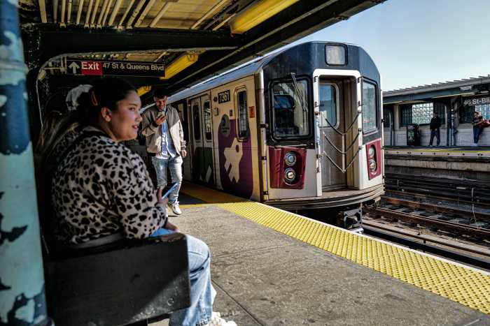 Subway train pulls into station in Queens on 7 line