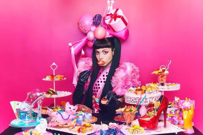 Soho's SUSHIDELIC turns Japanese delicacy into a thought-provoking journey of culture and flavor 7 SUSHIDELIC girl with plates of sushi