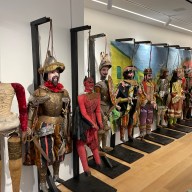 colorful puppets in side the Italian American Museum in Little Italy