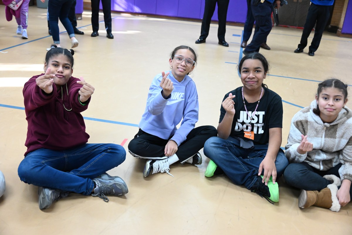 NYPD teams up with Big Ocean, K-Pop first hard-of-hearing act for surprise visit to Bronx school for deaf children 3 Big Ocean taught the students how to make a small Korean heart