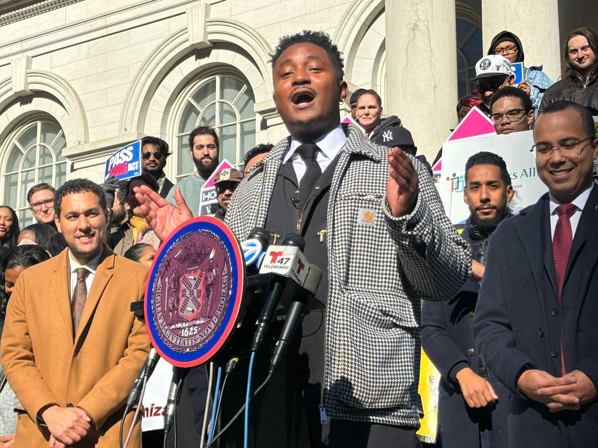 City Council Member Chi Ossé rallies with council members and advocates before the passage of his bill to relieve tenants from having to pay broker fees in most cases.