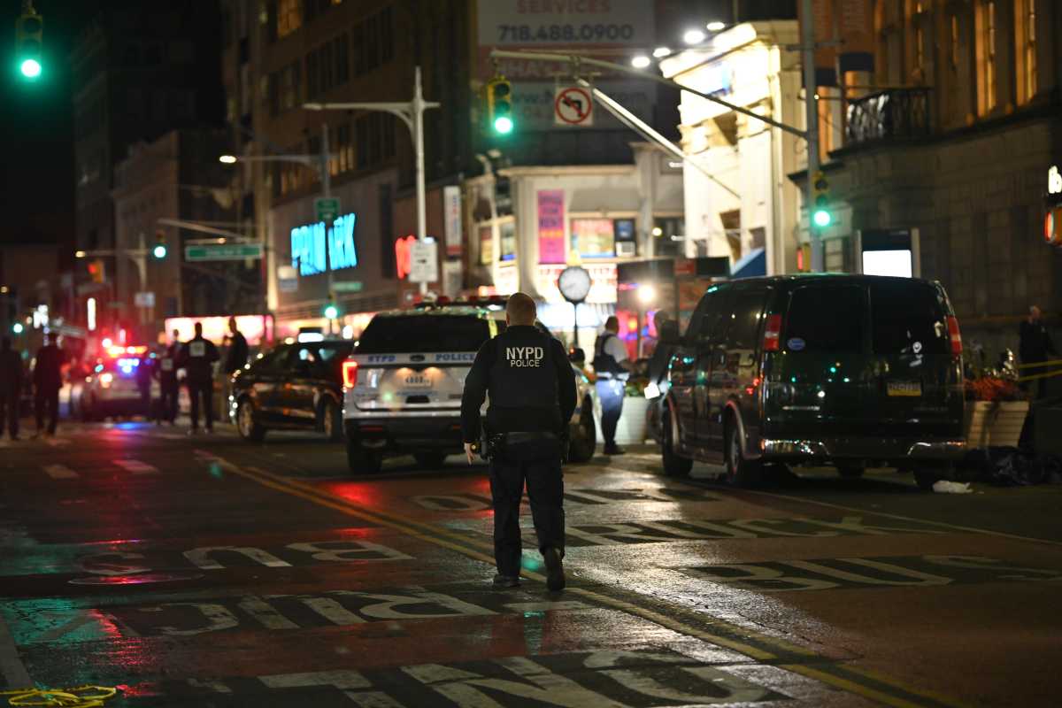 Police at the scene in Jamaica, Queens where a shootout between police and an armed robbery suspect on Nov. 19, 2024 ended with the perpetrator dead and an officer seriously wounded.