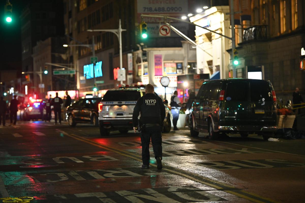 Police at the scene in Jamaica, Queens where a shootout between police and an armed robbery suspect on Nov. 19, 2024 ended with the perpetrator dead and an officer seriously wounded.