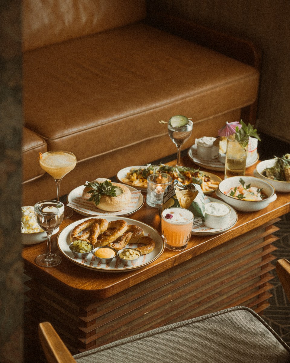 Wallflower blends 70s vinyl speakeasy vibes with a penthouse rooftop bar 2 Wallflower's food and cocktail spread