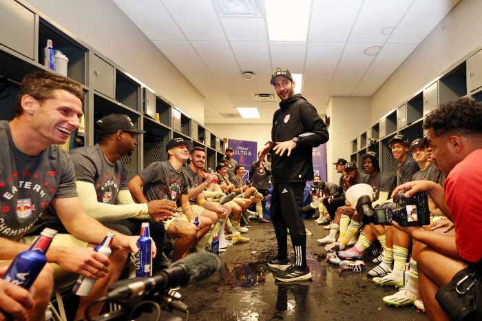 Red Bulls head coach Sandro Schwarz talks with the team after winning the 2024 MLS Cup Eastern Conference Final match at Inter&Co Stadium.