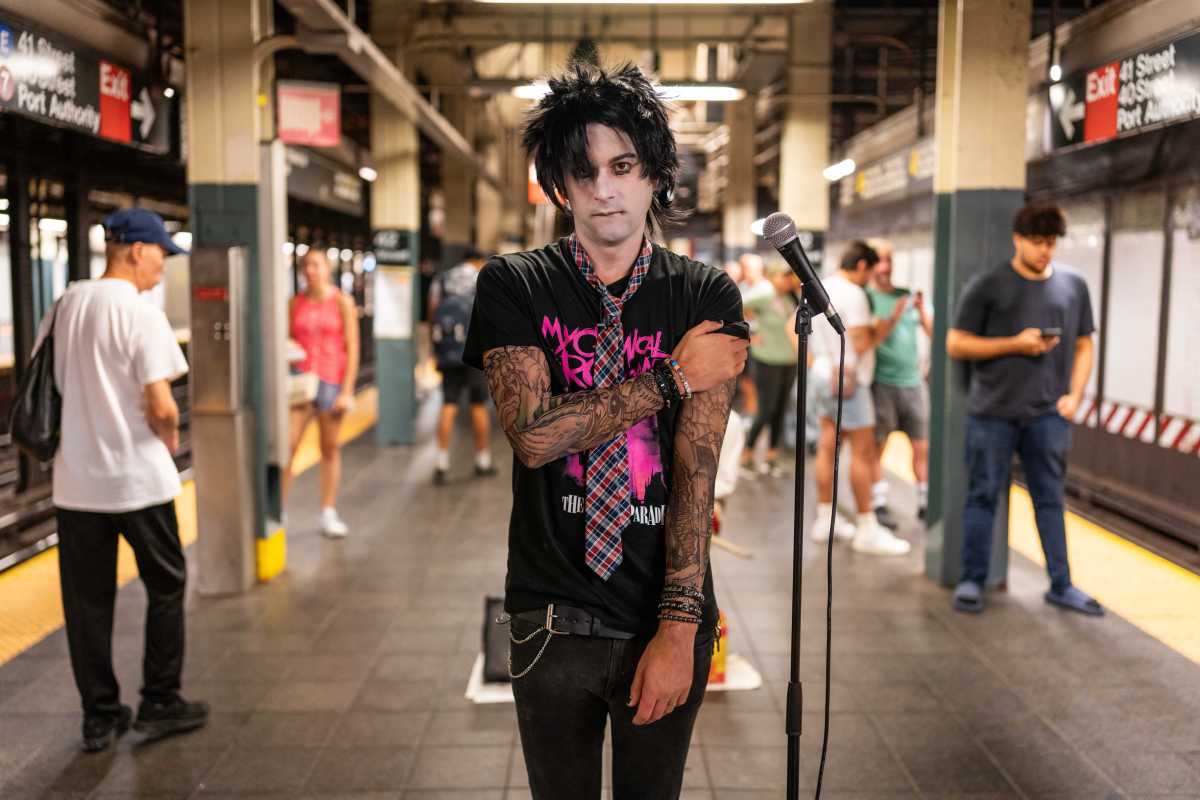 Marcus Monroe being emo on a subway platform.