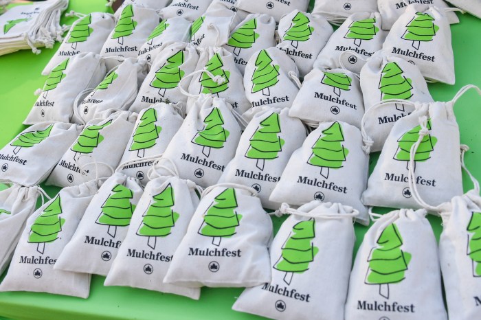 NYC Christmas trees return to the Earth during Mulchfest 2025 2 Bags of mulch on a table