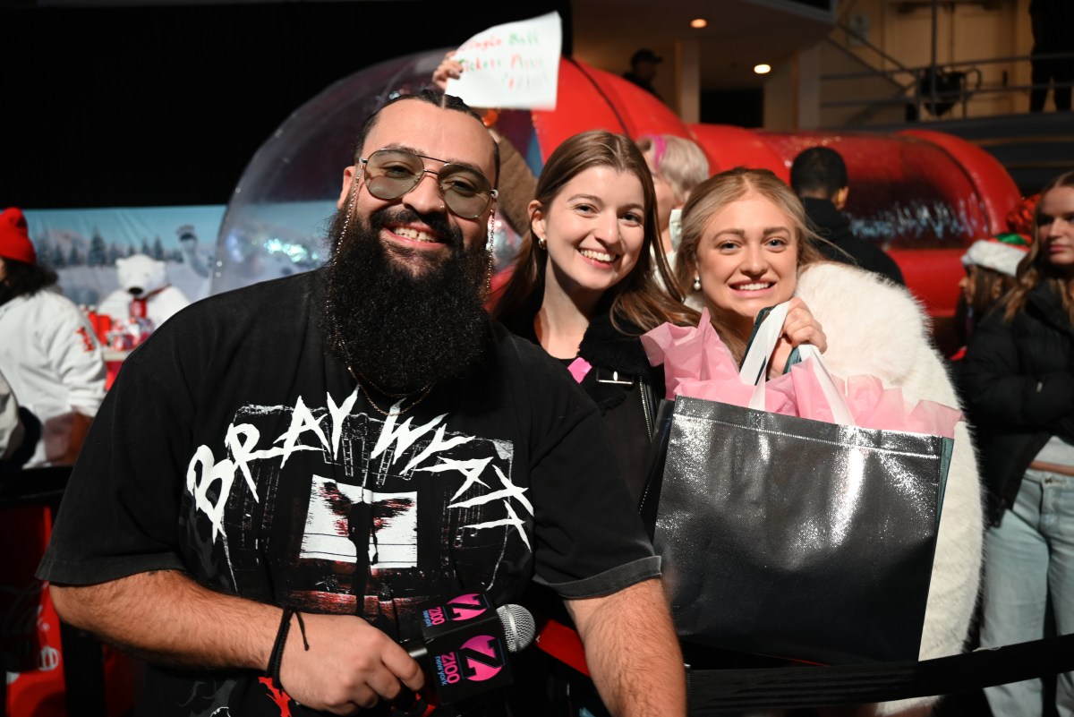 Z100 brings holiday magic with free Midtown concert and giveaways 2 z100 host Josh Martinez with fans.