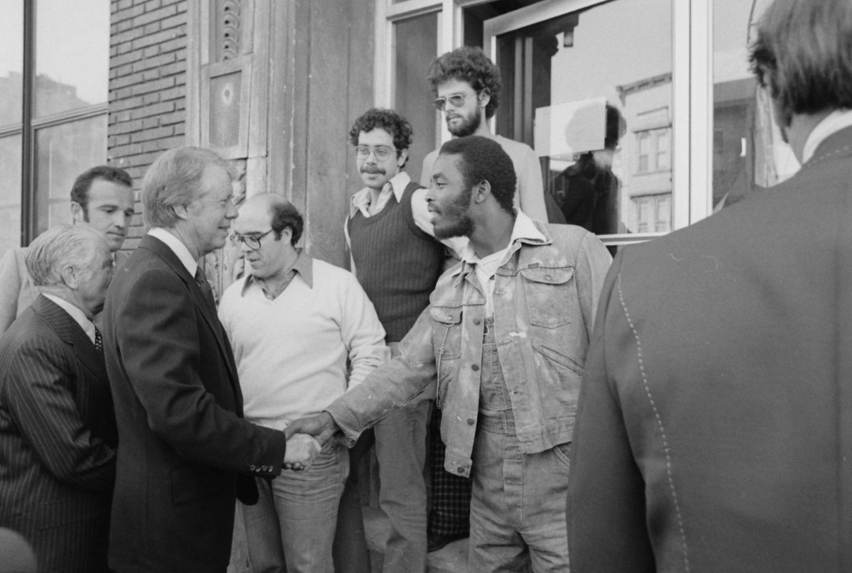 A look back: New Yorkers remember the life and legacy of Jimmy Carter 2 Jimmy Carter shakes hands with South Bronx resident