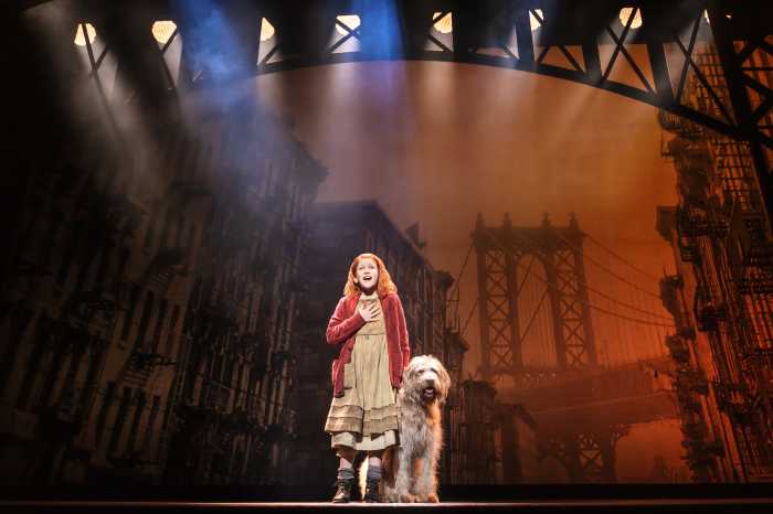 Hazel Vogel as Annie, with Kevin as Sandy, in the 2024 production of "Annie" at MSG, directed by Jenn Thompson.
