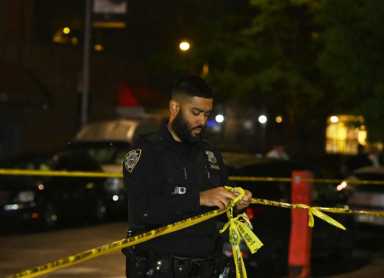 FILE - Police at a Brooklyn crime scene
