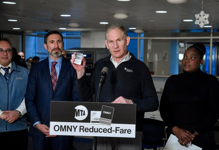 MTA's reduced-fare OMNY program now available to seniors in NYC 2 people at a podium with one person holding up a reduced-fare OMNY card