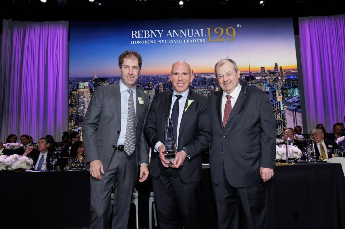 Honorees pose with REBNY heads during the annual address.