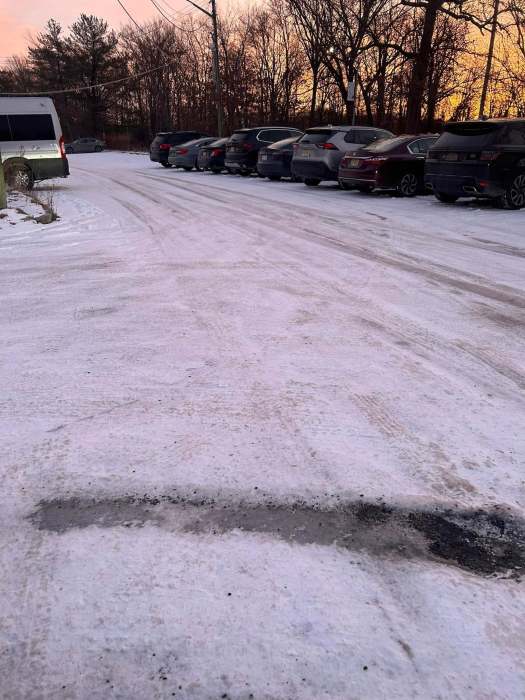 Out in the cold: City and state agencies play blame game as Staten Island express bus stops remain dangerously icy 3 a parking lot on Staten Island that is icy