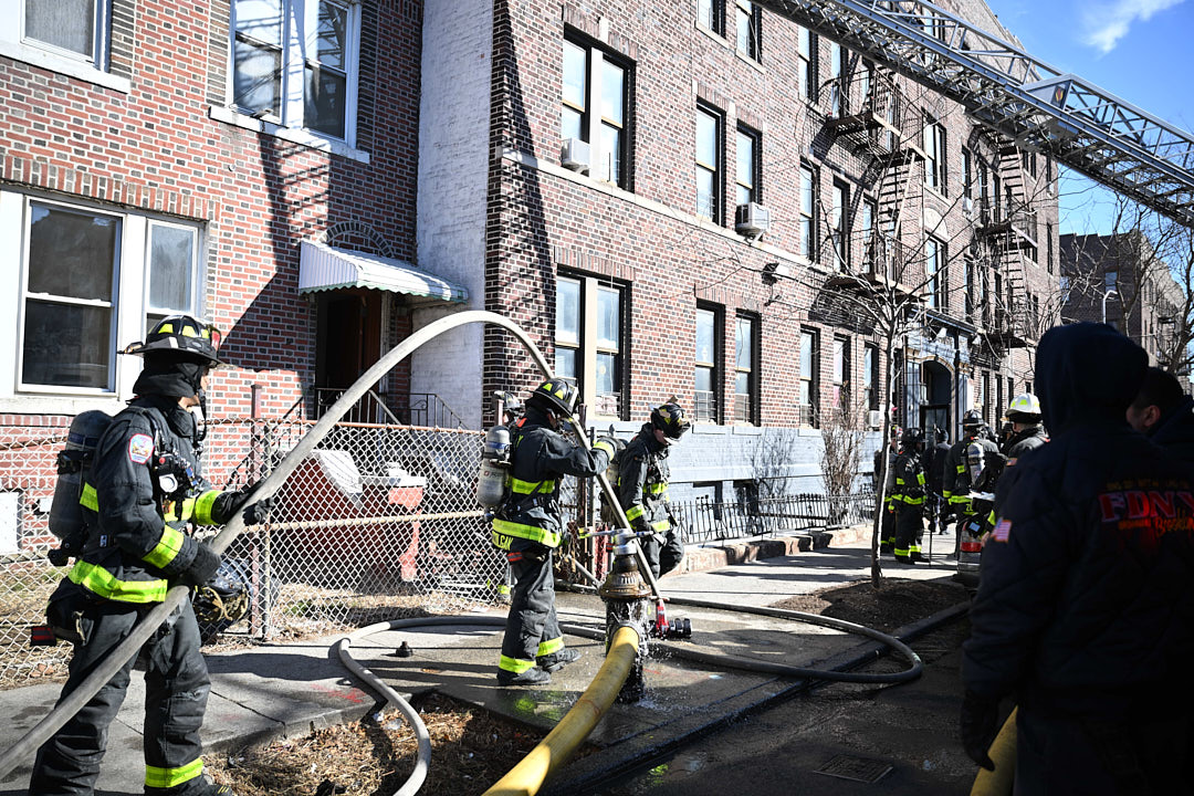 Firefighters work on a fire in a Brooklyn basement.
