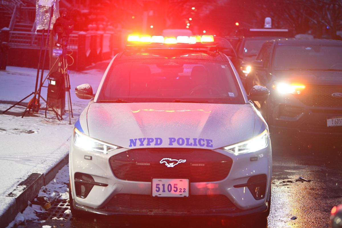 Brooklyn police shooting critically wounds armed suspect who pointed gun at cop during pursuit: NYPD 2 Brooklyn police vehicle outside location of police-involved shooting