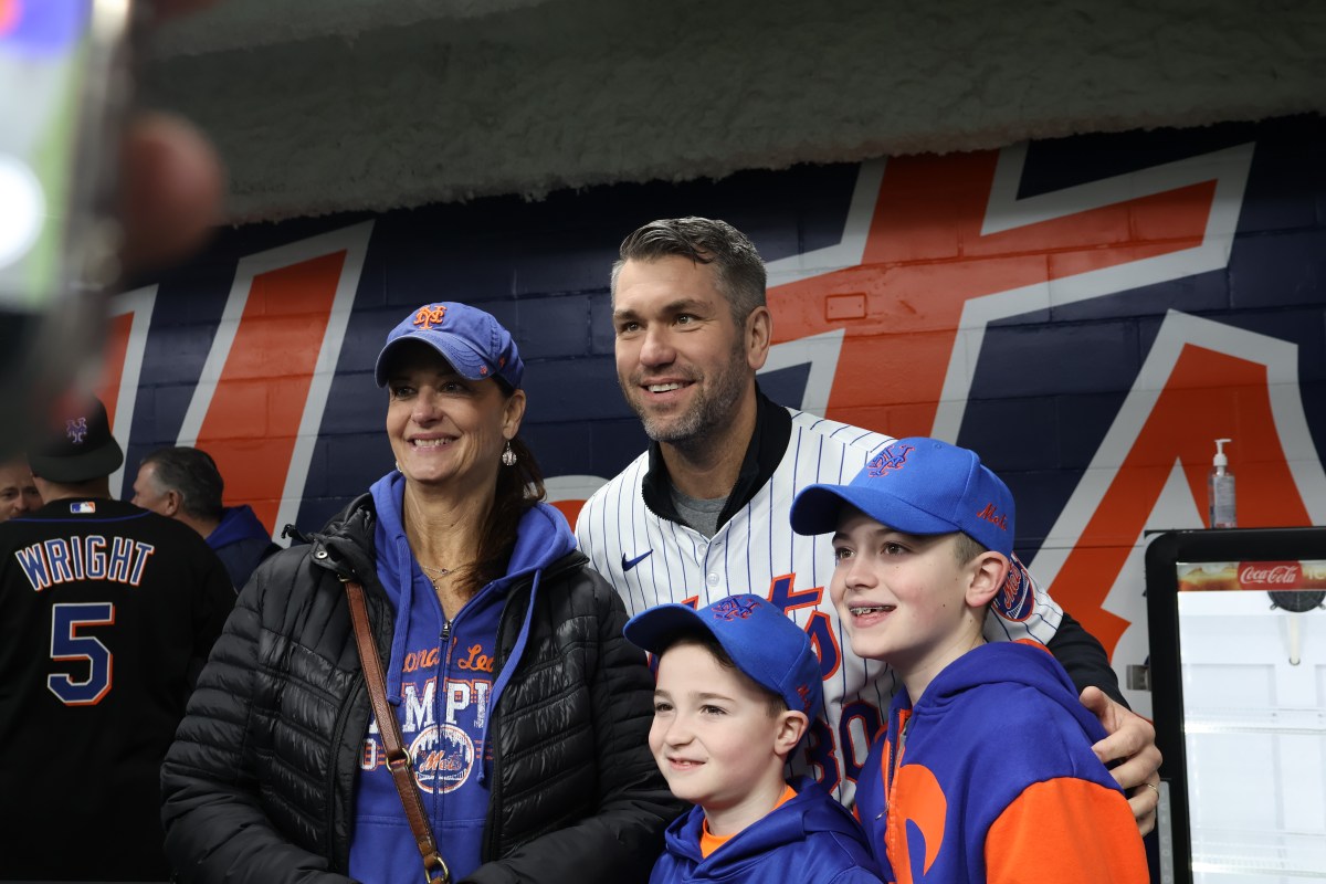 Mets’ 2025 season is fueled by excitement and expectations 4 Mets player Josh Thole (center) takes a photo with three mets fans