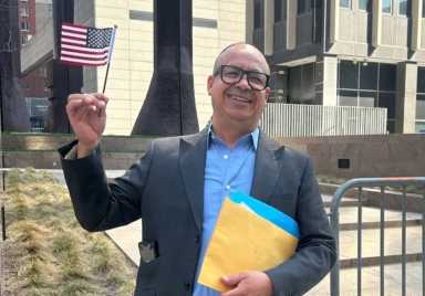 A man holding an American flag