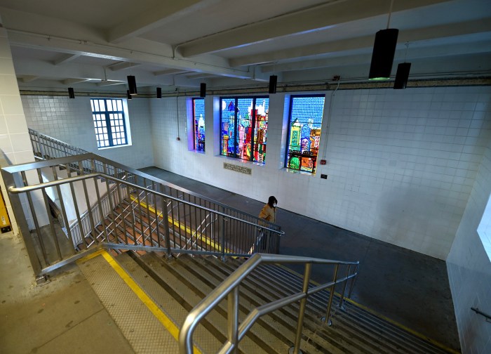 Historic Bronx subway station gets makeover and is now ADA-accessible 2 person walking in side a large Bronx subway station that has stairs