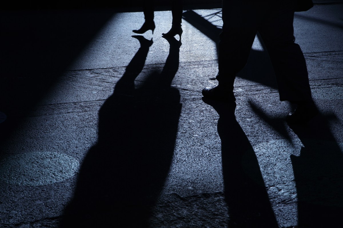 Stalking victim being followed in shadows
