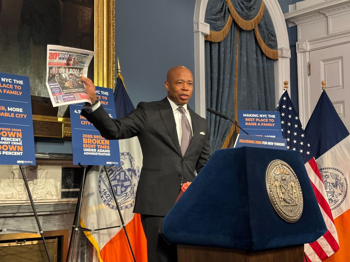 Mayor Adams had colonoscopy in January, prompting tests that sidelined him last week 2 Mayor Adams holding up copy of amNewYork Metro