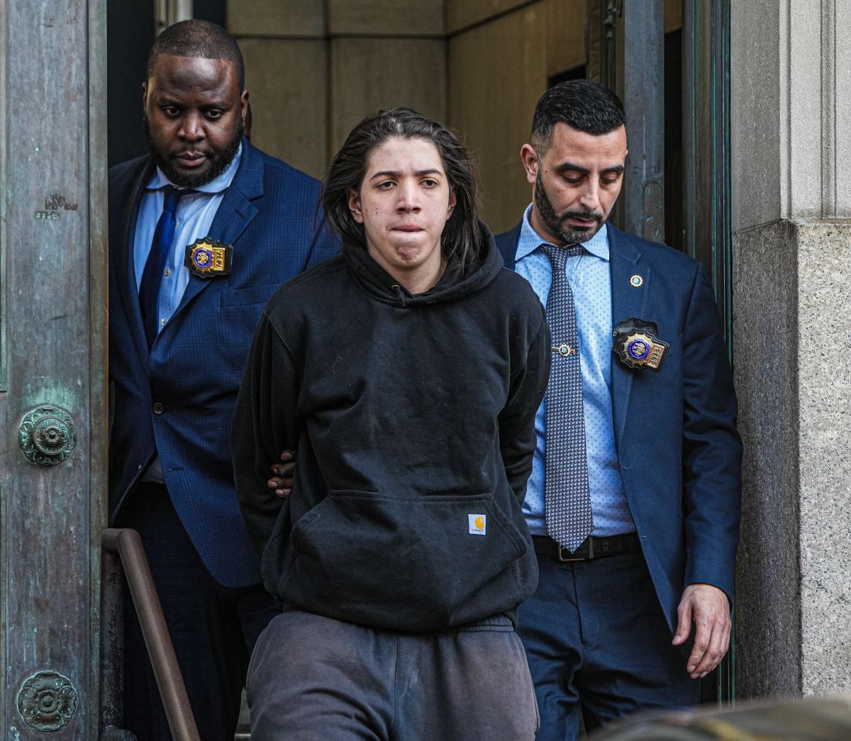Suspect in Brooklyn murder led out in handcuffs