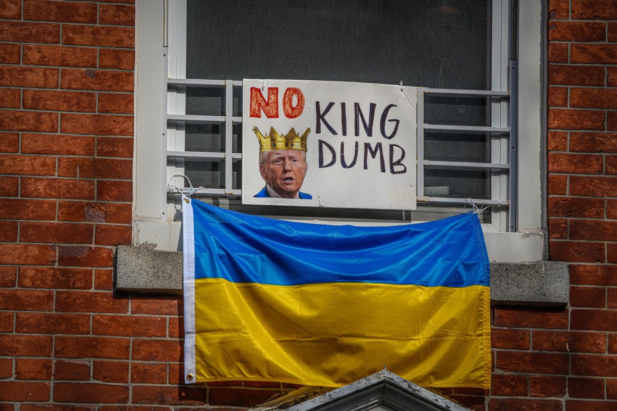 Ukrainian flags can be spotted plastered across glass and hanging from window sills with photos of Trump reading “No kings.” Other banners read: “abort Prez Musk.”