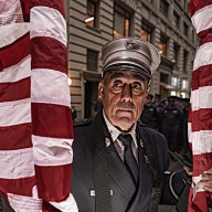 FDNY captain with American flags ahead of St. Patrick's Day parade