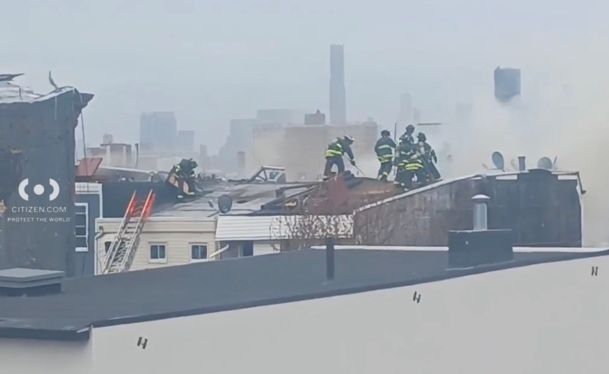 Firefighters battle fire on roof of Brooklyn building