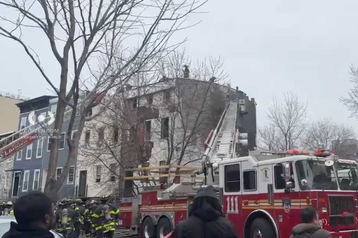 Firefighters at scene of Brooklyn fire where firefighter suffered cardiac arrest