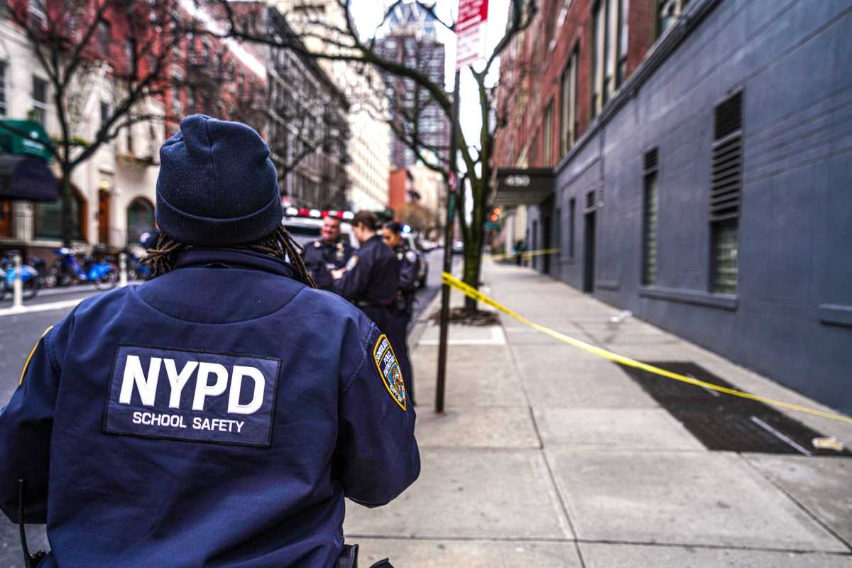 Police investigate Manhattan scene where young man was stabbed