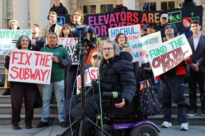 Commuters rally at City Hall to support funding NYC subway and transit improvements: 'We have to fix it now' 5 people outside on steps holding signs to support funding for NYC subway and transit improvements